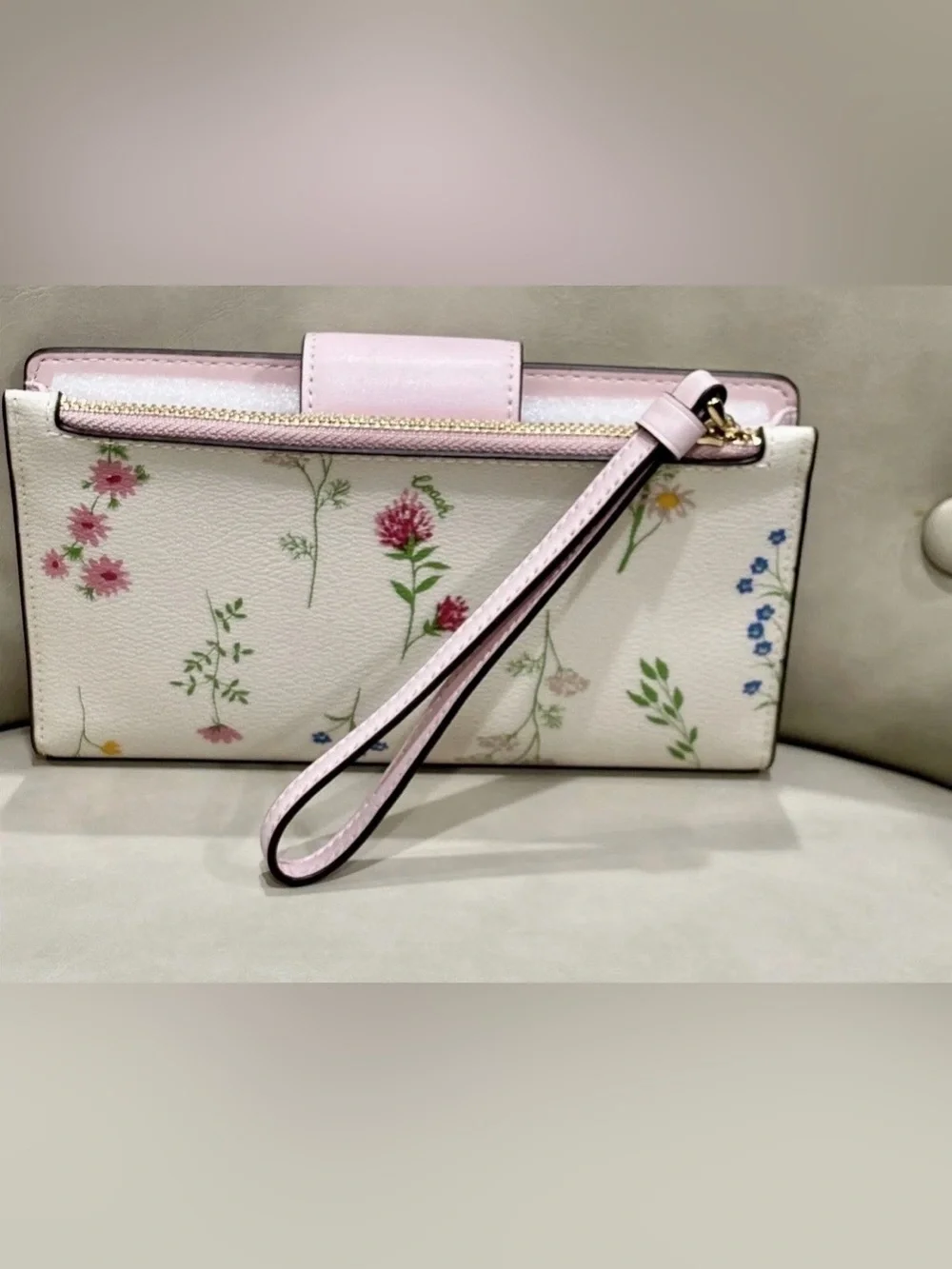 Coach white Leather Multi Color Flower Print phone Wristlet Wallet.